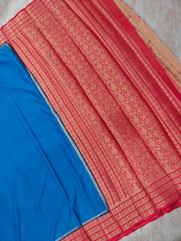 CREPE GEORGETTE IN ROYAL BLUE WITH PEACH  BORDER