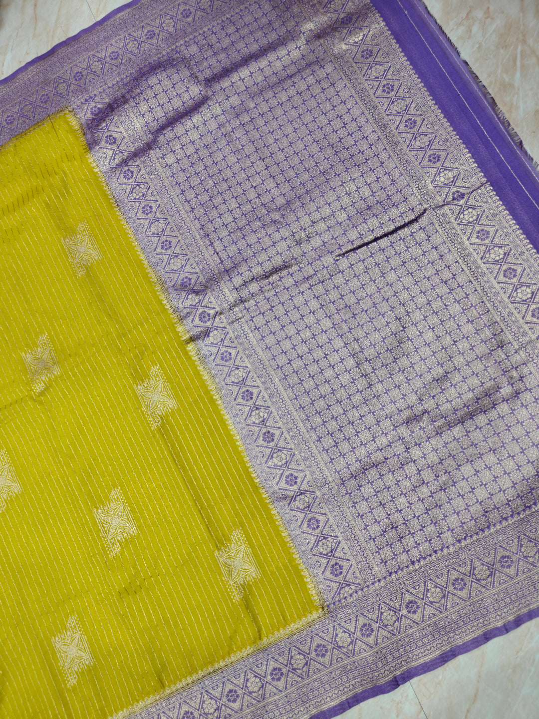 GEROGETTE IN GOLD WITH LAVENDER COLOUR BORDER