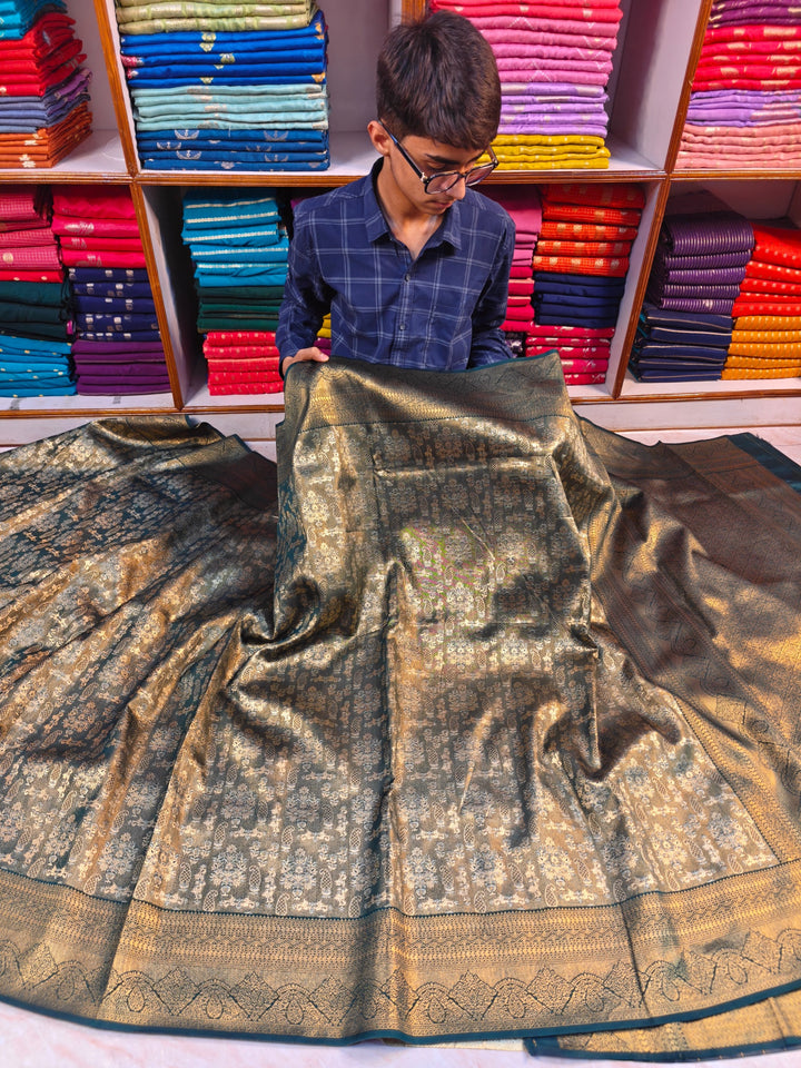 DHARMAVARAM TISU ALFI IN BOTTLE GREEN WITH INTRICATE ZARI WORK
