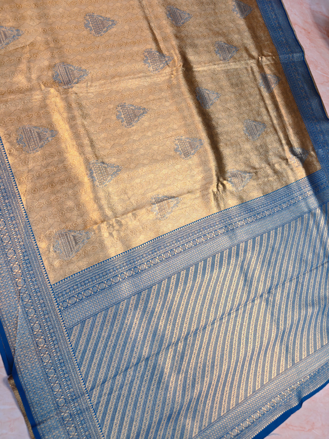 DHARMAVARAM ALFI IN GOLD WITH MEENA BOOTA AND BLUE BORDER