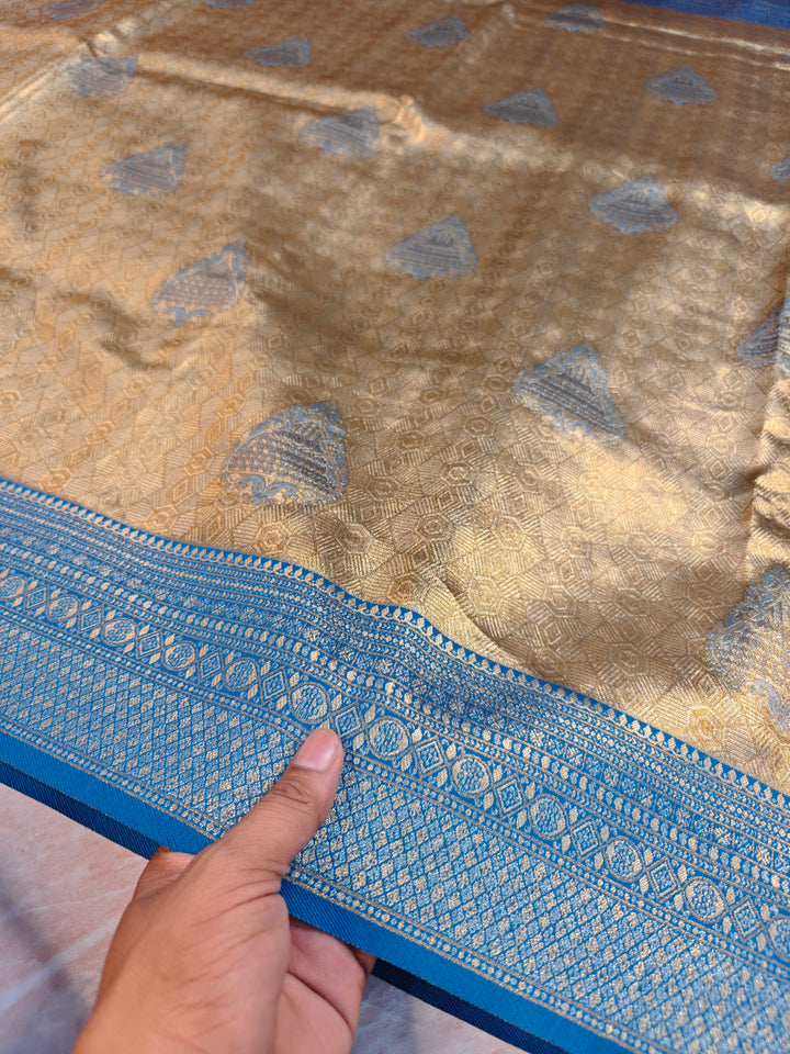 DHARMAVARAM ALFI IN GOLD WITH MEENA BOOTA AND BLUE BORDER