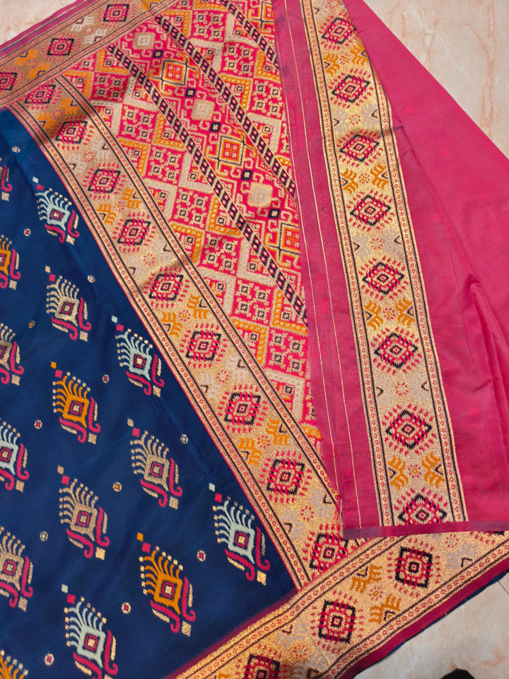 SEMI KATAN SOFT SILK IN NAVY BLUE MULTI BOOTA WITH RED MINAKARI BODY