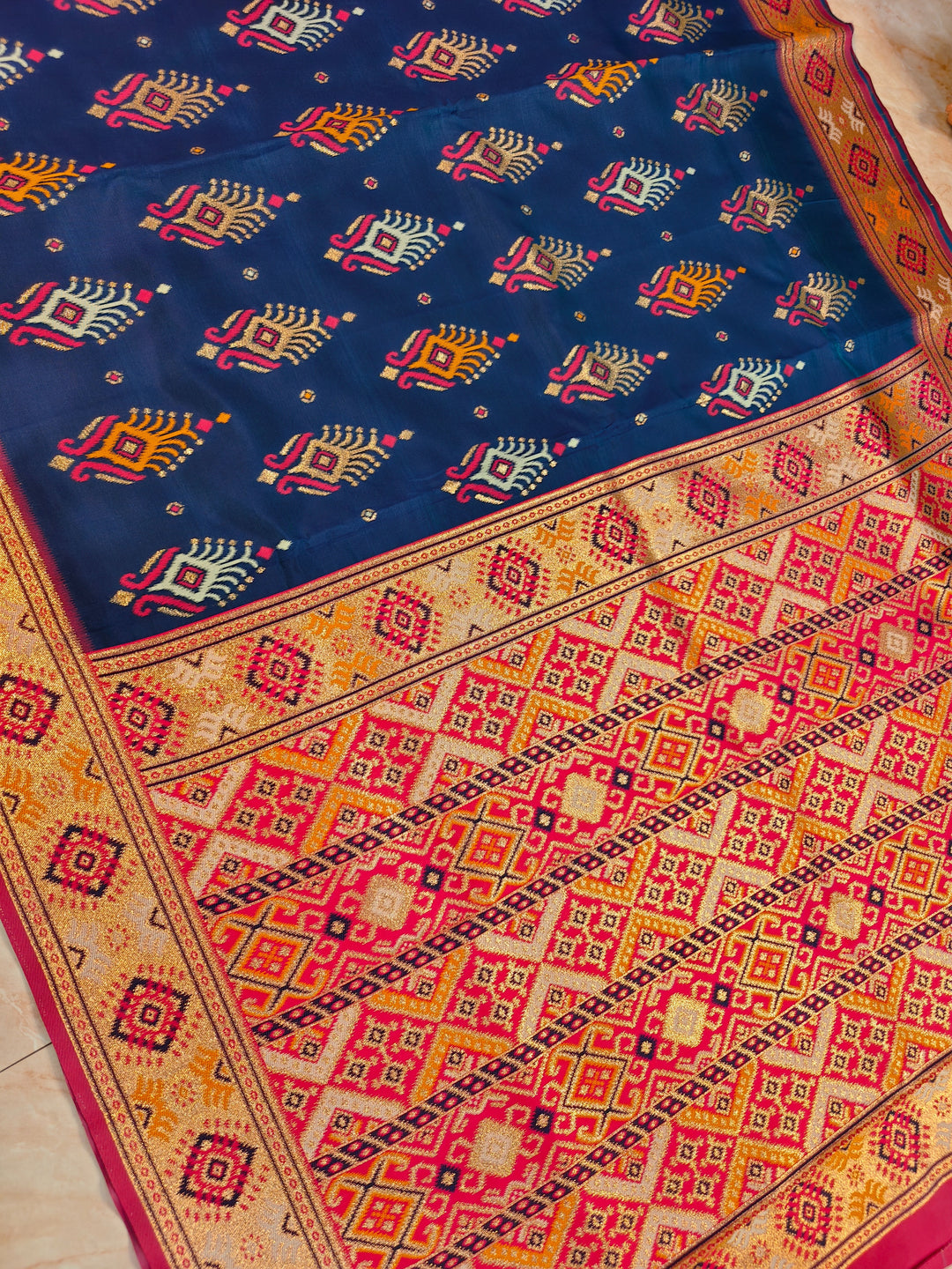 SEMI KATAN SOFT SILK IN NAVY BLUE MULTI BOOTA WITH RED MINAKARI BODY