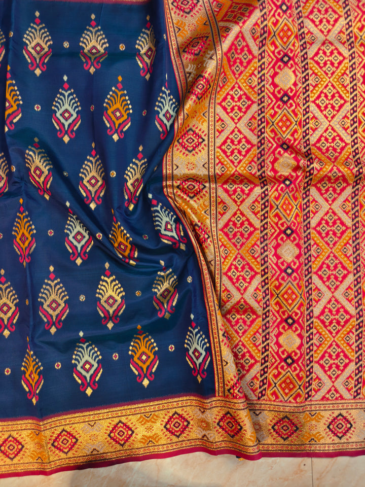 SEMI KATAN SOFT SILK IN NAVY BLUE MULTI BOOTA WITH RED MINAKARI BODY