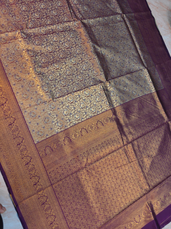 DHARMAVARAM TISU IN SILVER AND  GOLD WITH MAGENTA BORDER