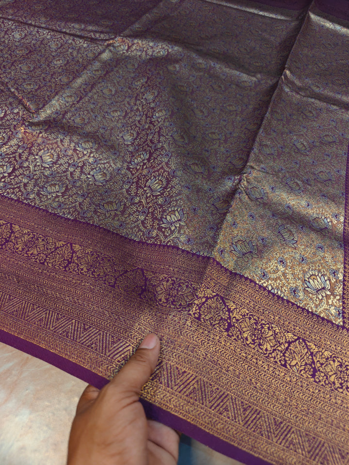 DHARMAVARAM TISU IN SILVER AND  GOLD WITH MAGENTA BORDER