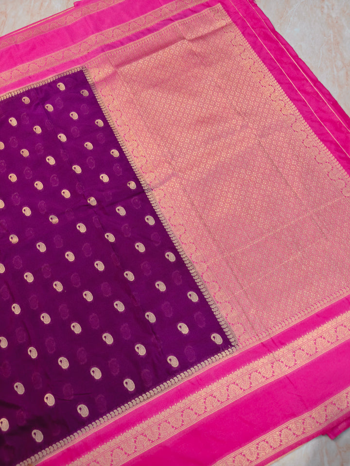KHADDI GEORGETTE IN MAGENTA WITHBABY PINK BORDER