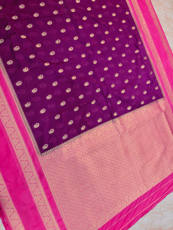 KHADDI GEORGETTE IN MAGENTA WITHBABY PINK BORDER