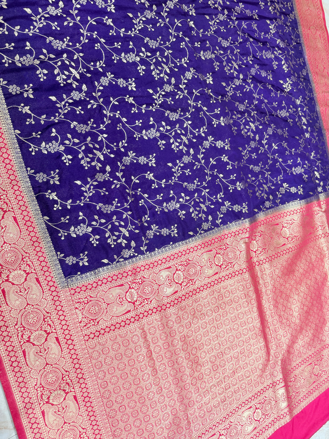 SEMI KHADDI GEORGETTE IN DEEP PURPLE WITH RANI PINK BORDER WITH FLORAL JAAL